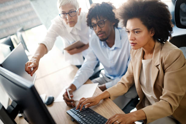 istock Group of successful business people at work in office 1272378828