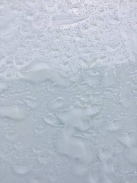 istock Water droplets on the gray background. 1272379728