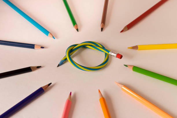 istock Flexible pencil and a set of colored pencils on a light background. Selective focus. 1272380505