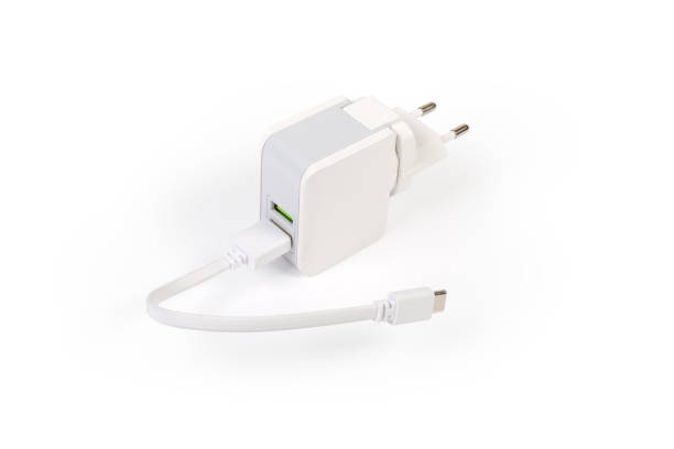 istock Mobile devices charger with two output ports and connected cable 1272380524