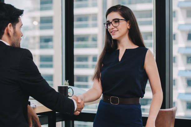 istock Business people shaking hands. Handshake Gesturing People Connection Deal Concept.Image of businesswomen Handshaking,happy with work,the woman she is enjoying with her workmate 1272381716