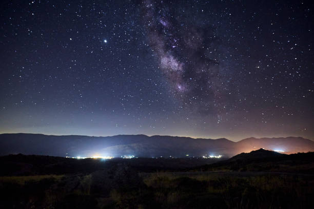 istock Starry night with the Milky Way over some mountains 1272382736