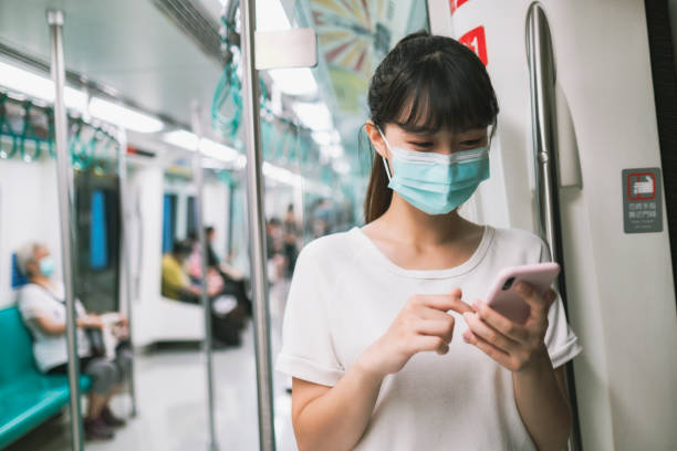 istock woman with mask in metro 1272383070