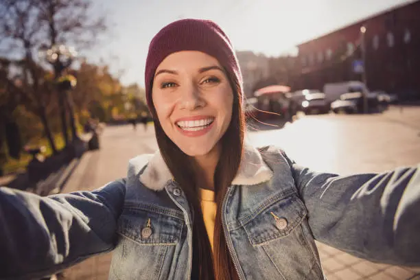 Self-portrait of her she nice attractive pretty lovely cheerful cheery brown-haired girl spending free time strolling alone fresh air traveling, abroad October streetstyle