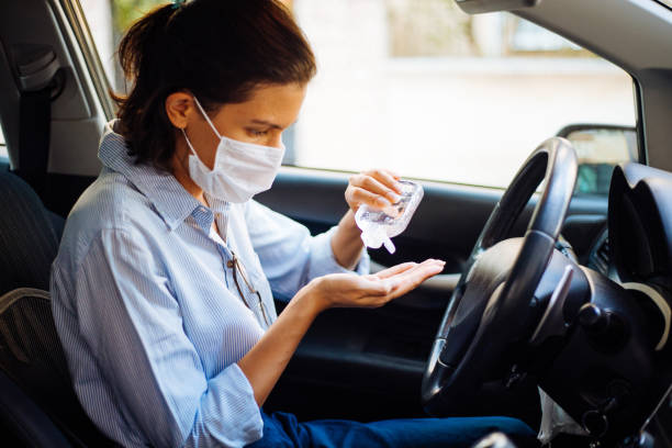 istock Woman cleaning her hands for prevent Covid-19 1272385990