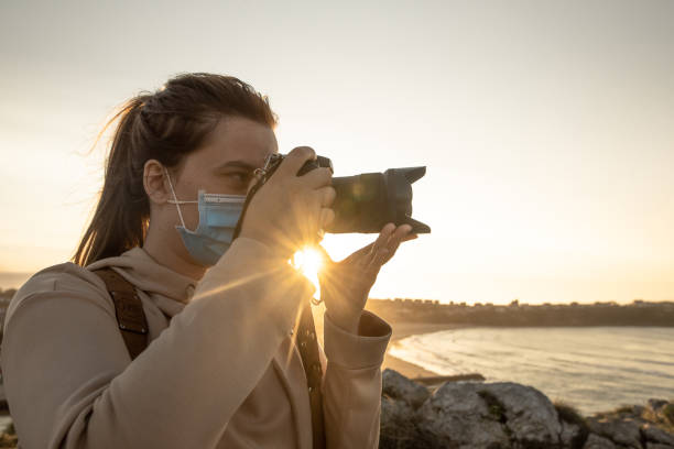 istock Female photographer wearing a face mask 1272392252