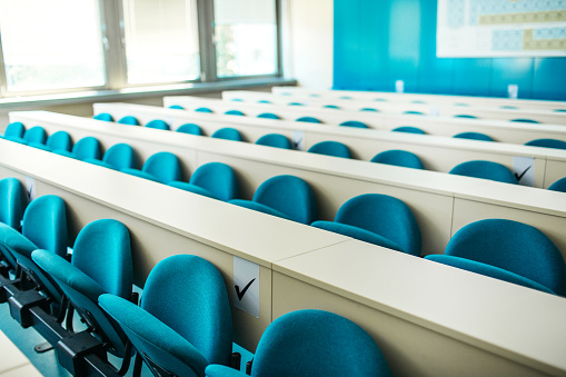 Shot of an empty university classroom regarding covid 19