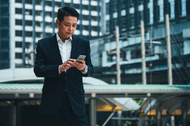 istock Business man using phone stock photo 1272394643