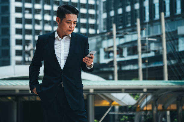 istock Business man using phone stock photo 1272394645