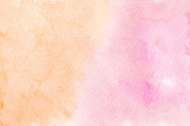 istock Hand painted soft orange and pink watercolor background. 1272395071