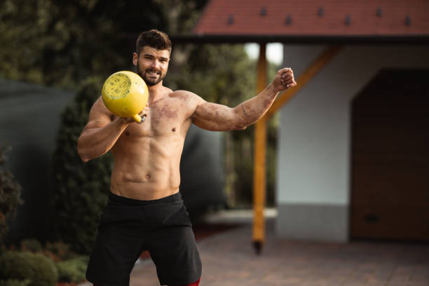 istock Muscular young man exercising in backyard 1272395825