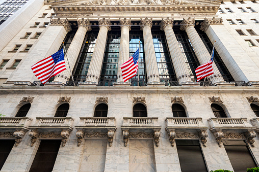 Manhattan, New York, USA - May 26, 2014: New York Stock Exchange at Wall Street. It is the largest stock exchange in the world by dollar volume. The Stock Exchange, the synonym of business, is located at Wall Street in lower Manhattan, designed by George B Post