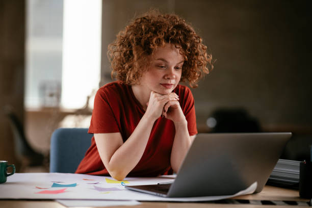 istock Beautiful businesswoman working on project. 1272397680