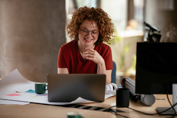 istock Beautiful businesswoman working on project. 1272398797