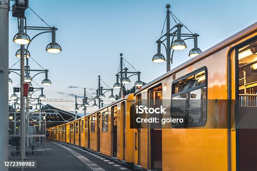 istock old yellow metro train in Station in Berlin 1272398982