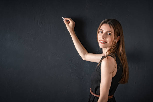 istock Business woman writing on a board 1272398993