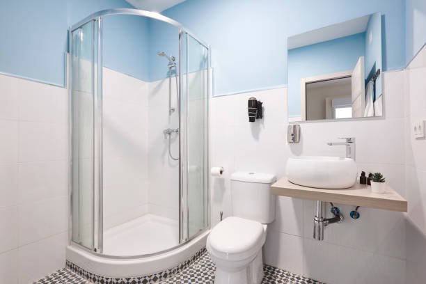 istock Bathroom with shower cabin, sink and basin. Hotel indoor 1272400114