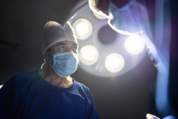 istock Focused surgeons working together on a surgery 1272400333