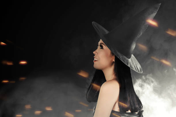 istock Asian witch woman with hat standing 1272402061