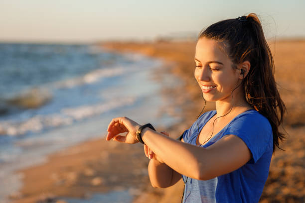 istock woman checking distance and heart rate 1272402208