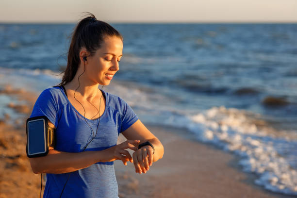 istock woman checking distance and heart rate 1272402232
