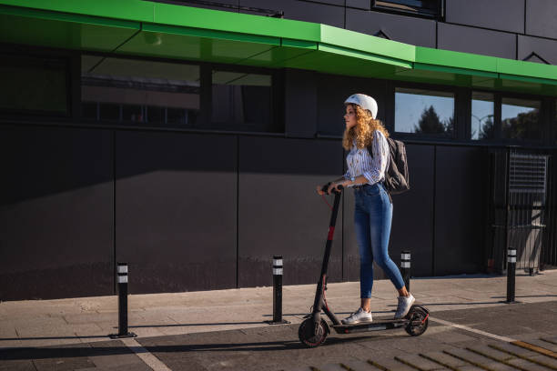 istock Beauty rides push scooter at sunset after work 1272405924