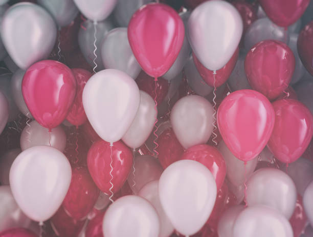 istock Balloons pink and white background 1272405952
