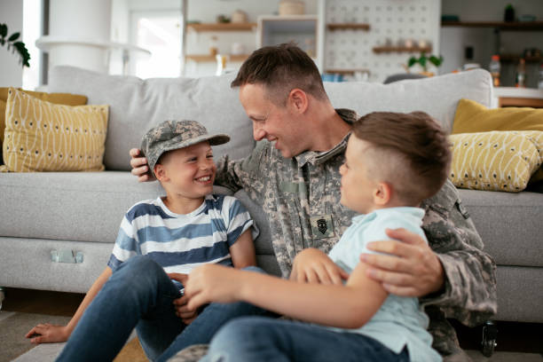 istock Soldier enjoying at home with children. 1272408336