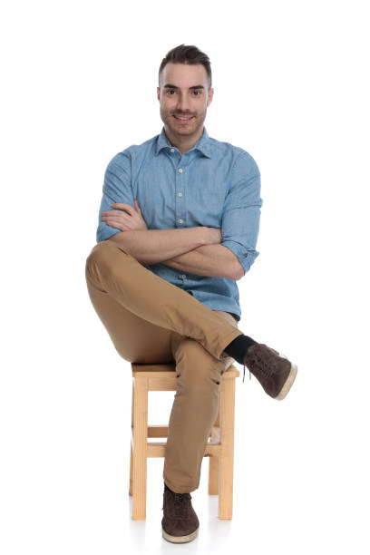 istock Happy smart casual man smiling with his hands folded 1272408345