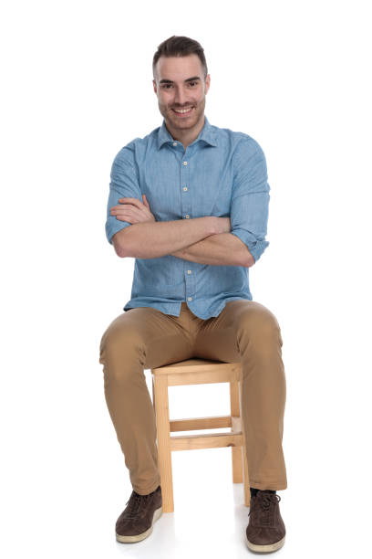istock Positive smart casual man smiling with hands crossed 1272408600