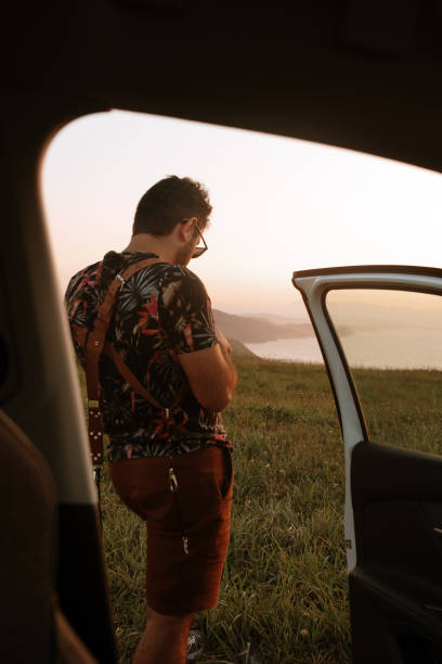 istock Rear view of a man outside his car 1272409926