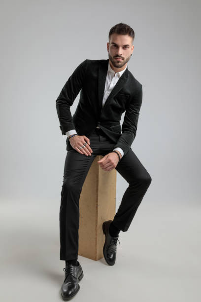 istock sexy businessman is posing against gray background 1272409978