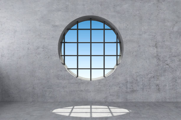 istock round window with grating in concrete wall 1272412913