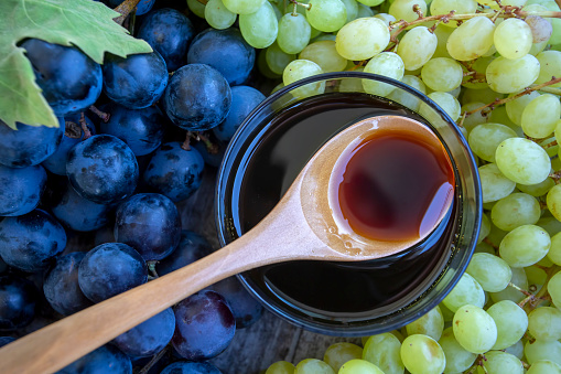 Grape molasses and fresh organic grapes