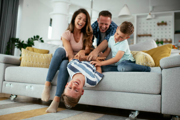 istock Happy parents with sons having fun. 1272414956