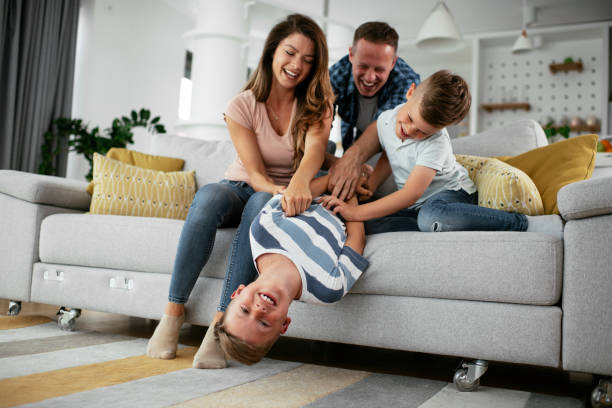 istock Happy parents with sons having fun. 1272416080