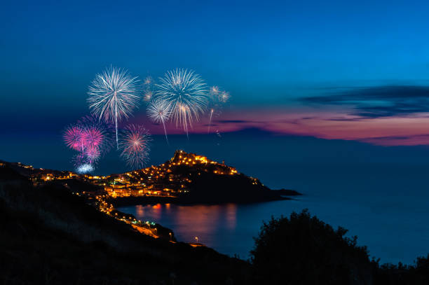 istock Landscape of castelsardo by night with fireworks 1272416093