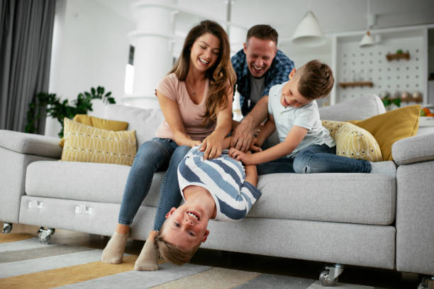 istock Happy parents with sons having fun. 1272416927