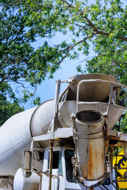 istock Cement truck mixer pouring cement 1272417071
