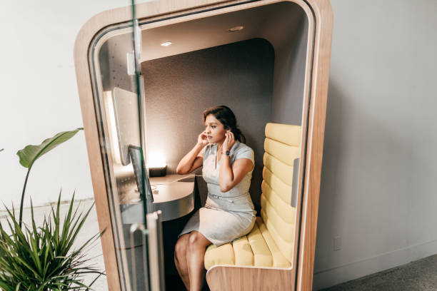 Planning for a new world. Multiethnic woman on her video chat with online  team Planning for a new world. Multiethnic woman on her video chat with online  team pay phone on the phone latin american and hispanic ethnicity talking stock pictures, royalty-free photos & images