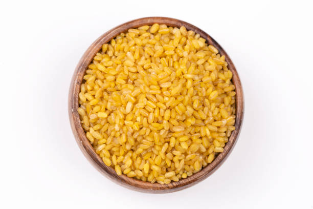 istock Heap of dry bulgur isolated on white 1272419652