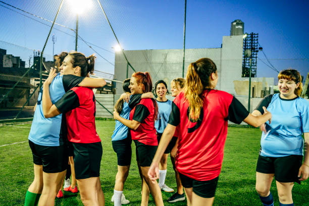 istock Footballers embracing and shaking hands after practice match 1272419968