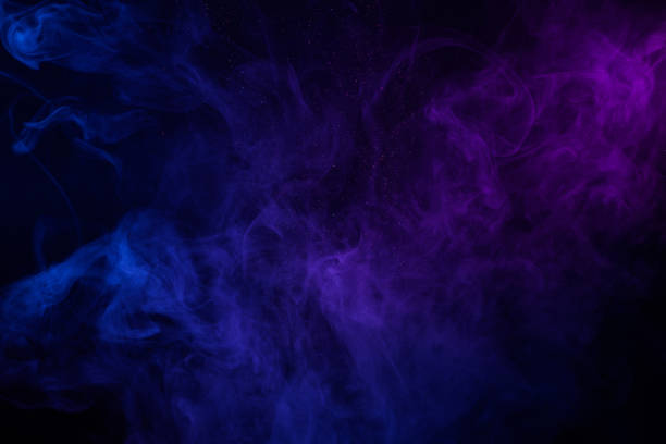 istock Colorful clouds of smoke and shiny dust 1272422618