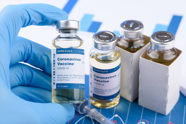 istock Scientist hold coronavirus vaccine vial 1272424434