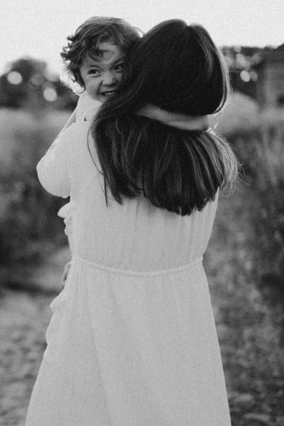 istock Woman playing with her child on the field during sunset 1272425160