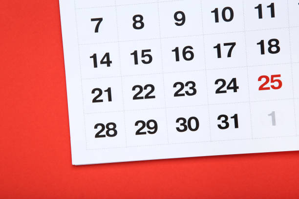 istock Paper calendar page on red background 1272426126