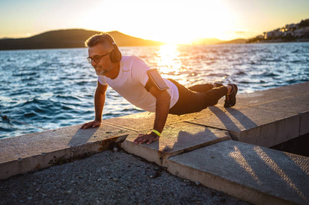 istock Man push up workout outside by the sea 1272427359