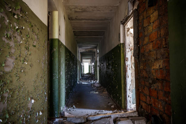 istock Long corridor of ruined abandoned house 1272434701