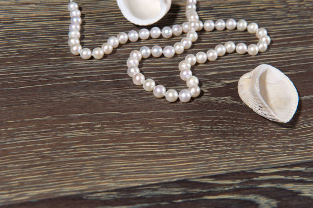 Pearl necklace on woman neck