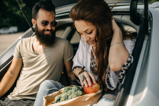istock Young couple packing groceries 1272437551